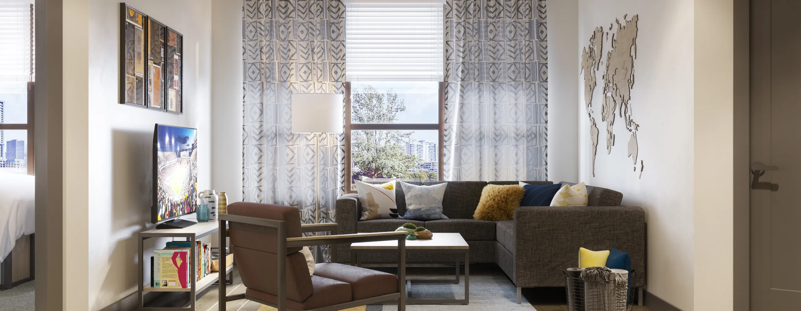 A furnished living room with a sectional sofa in a Canvas Tempe apartment