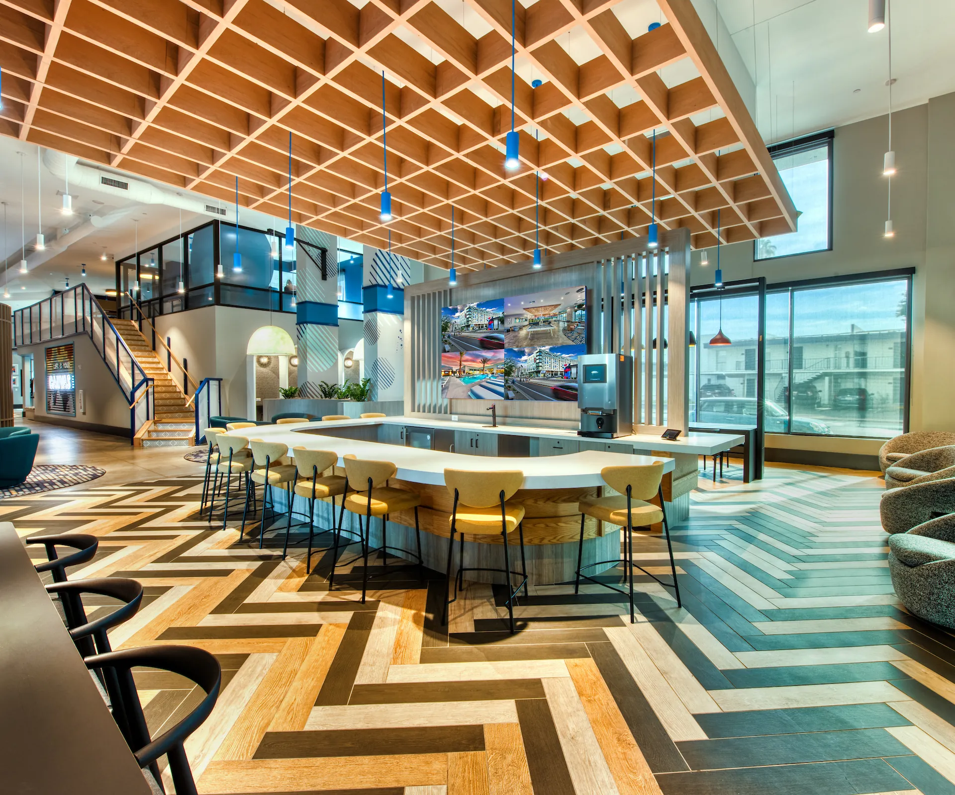 Communal tables and booth seating in the resident lounge at Canvas Tempe