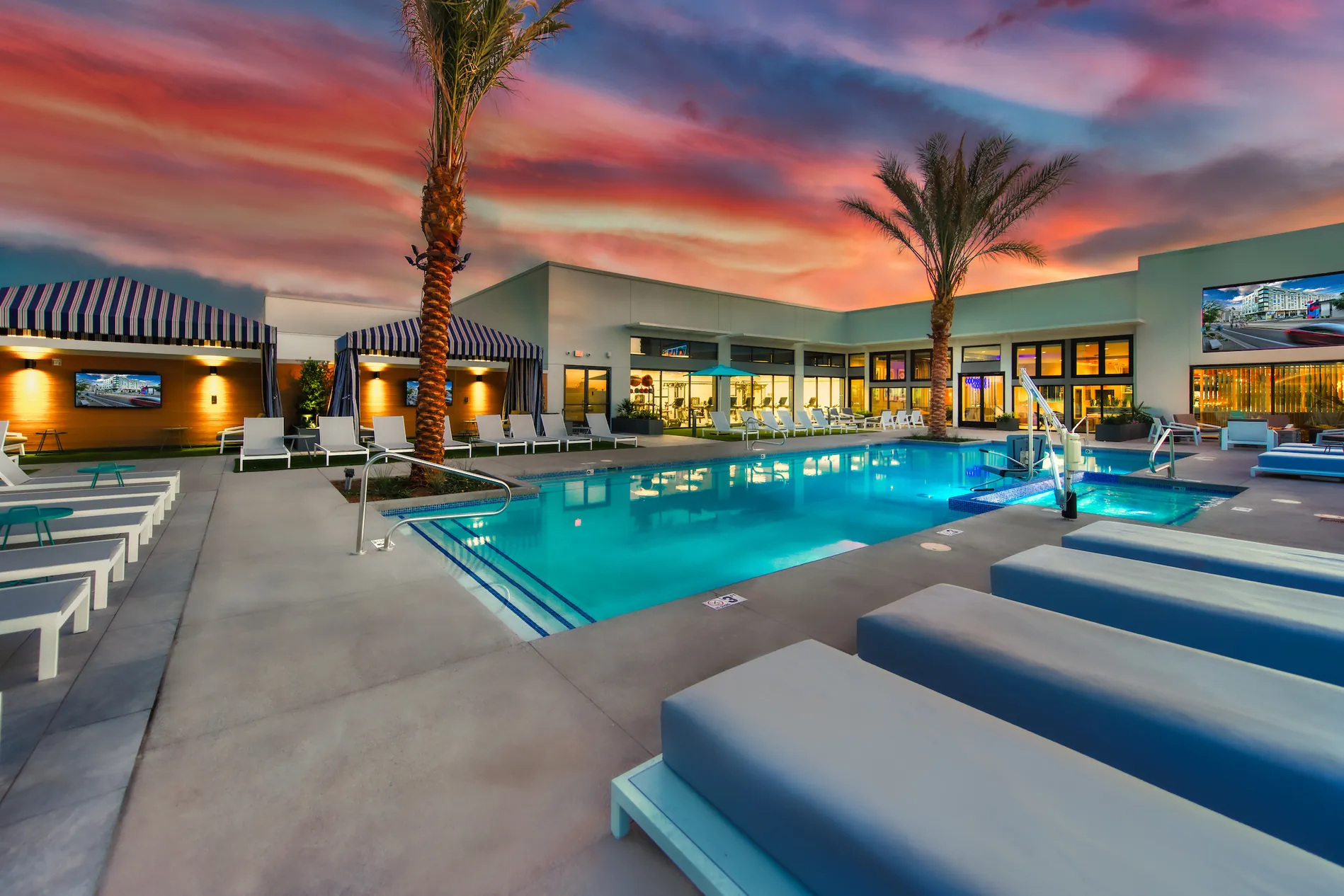 The rooftop pool and sundeck at sunset at Canvas Tempe