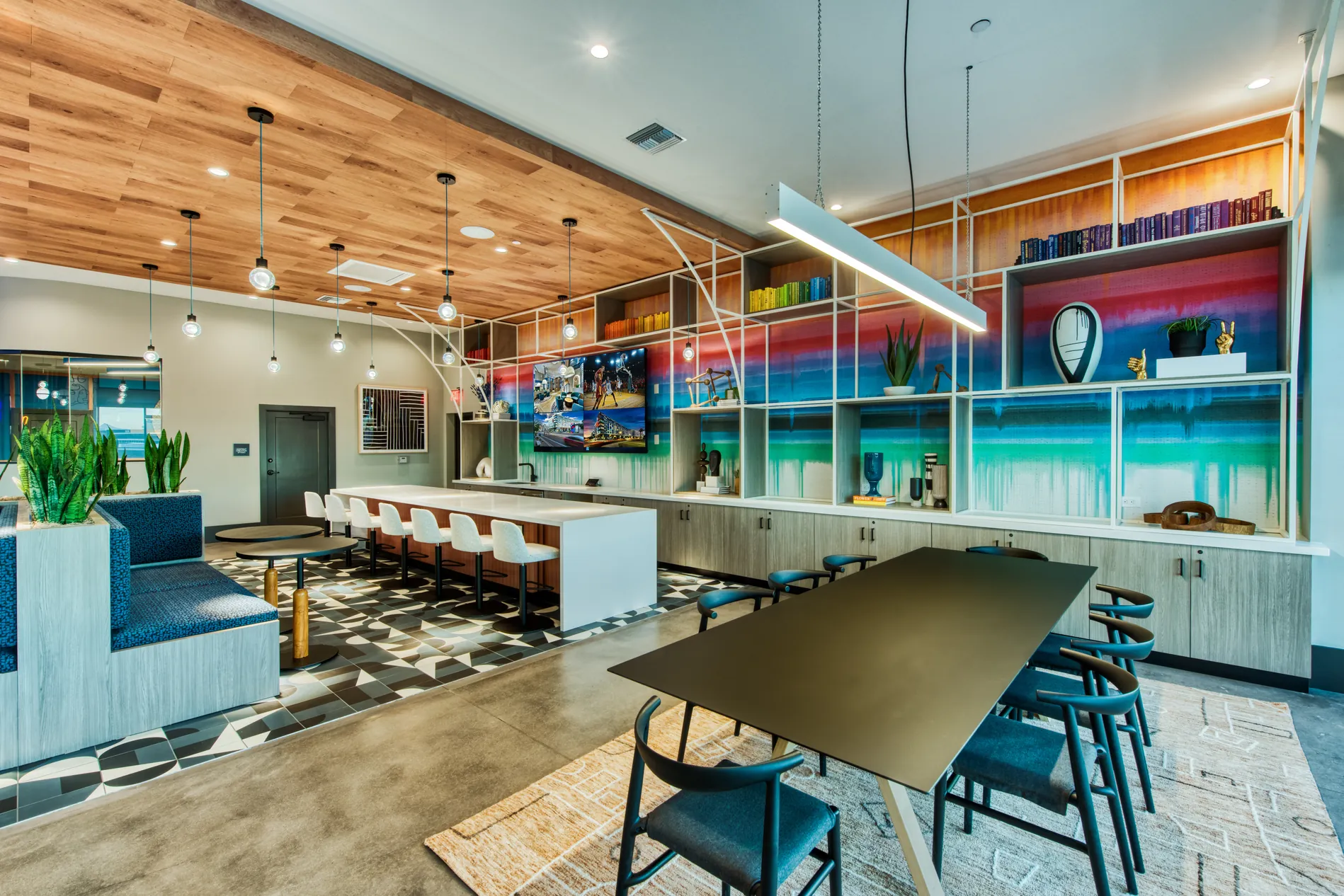 Counter seating and screens in the game lounge at Canvas Tempe